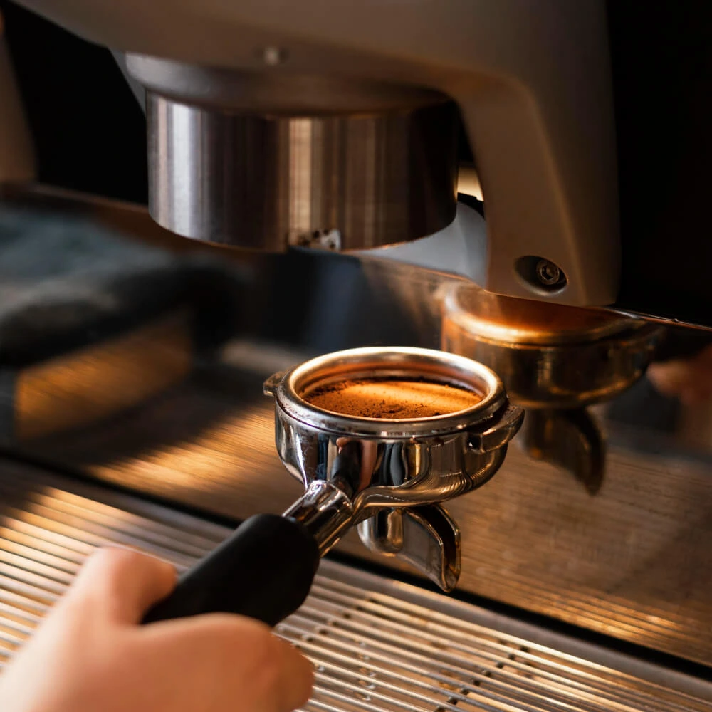 Close-up of coffee cup on wooden table in cafe