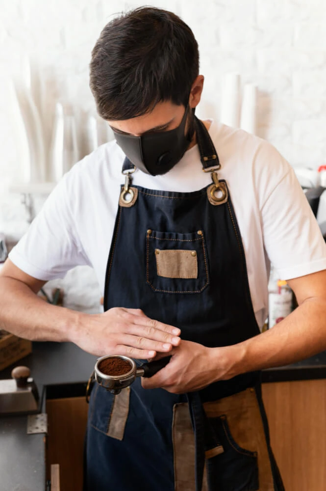 Person serving a cup of coffee