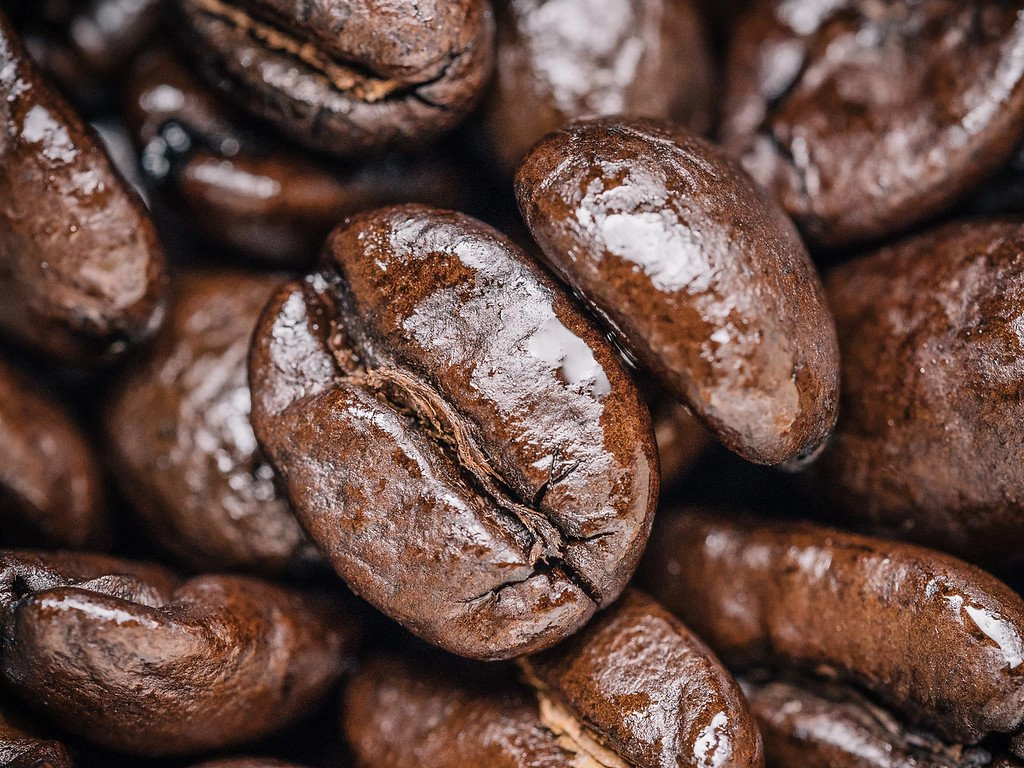 French roast coffee beans are typically dark and shiny