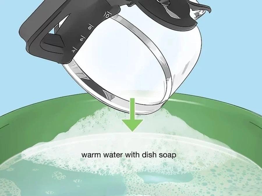 Soak the pot in warm water that has dish soap